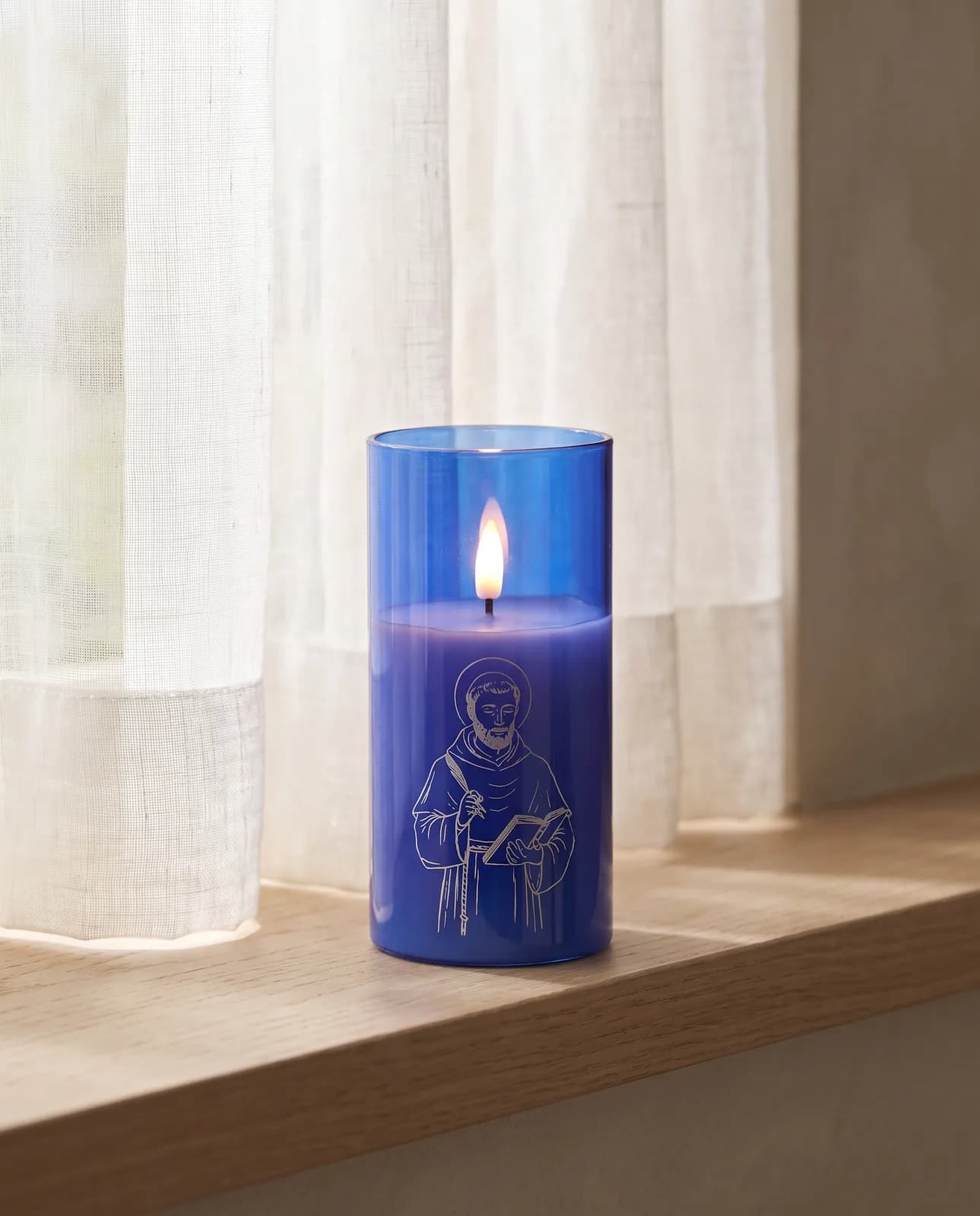 St. Thomas candle, blue glass, scene